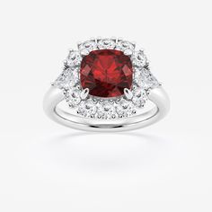 a red and white diamond ring with two halos on the sides, set in 18k white gold