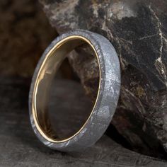 a close up of a ring on a rock