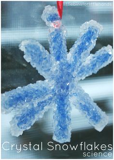 a snowflake is shown in front of a window with frosting on it