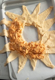 some tortilla chips are arranged in the shape of a star on a tray