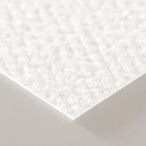 a close up view of the surface of a sheet of white paper that has been folded