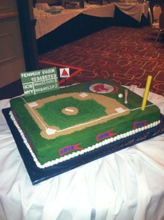 a baseball field cake is on a table