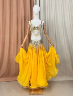 a mannequin wearing a yellow belly dance costume