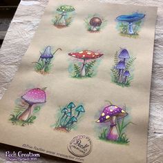 a piece of paper with different colored mushrooms on it