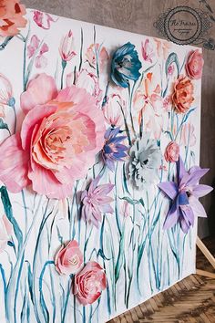 an easel with flowers painted on it