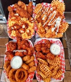 four baskets filled with different types of food on top of a table next to each other