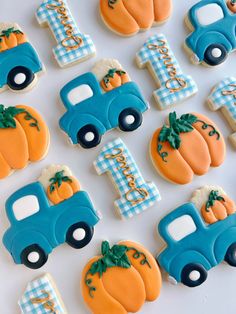 decorated cookies in the shape of trucks and pumpkins