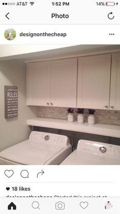 a white washer and dryer sitting next to each other in a laundry room