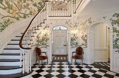 the foyer is decorated in white and black checkered flooring with floral wallpaper