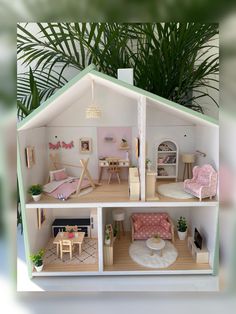 a doll house with furniture and plants in it