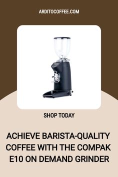 a coffee grinder sitting on top of a table next to a sign that says shop today