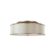 a light fixture with a white shade on the bottom and a gold trim around it