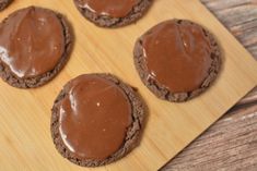 chocolate cookies on a cutting board with frosting