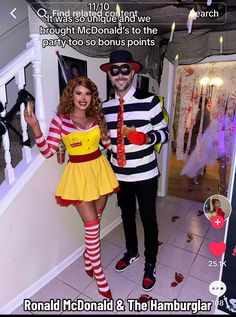 a man and woman dressed in costumes standing next to each other