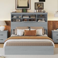 a bed with two nightstands and a bookcase above it in a bedroom setting