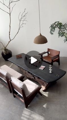 a living room filled with furniture and a tree in the middle of it's floor