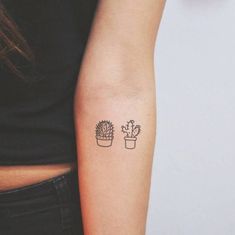 a woman's arm with a small cactus tattoo on the left side of her arm