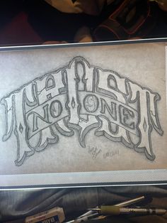 a drawing of the word no one is in it's frame with some pens and markers