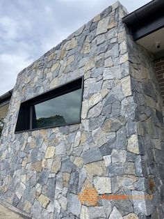 a building made out of rocks with a window