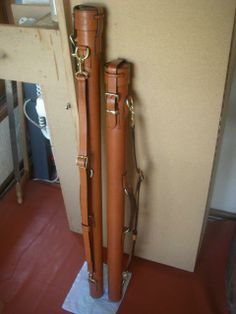 two brown suitcases sitting next to each other