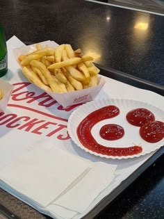 a tray with french fries and ketchup on it