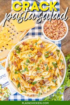 a bowl filled with pasta and cheese on top of a blue checkered table cloth