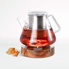 a glass tea pot filled with red liquid