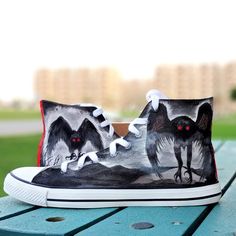 "⭐ FREE SHIPPING ⭐  Do you want to stand out from the rest? Mothman high top sneakers for men are perfect for you! These custom sneakers are perfect boyfriend gift ideas or husband and are perfect for Halloween/Christmas/Birthdays. They are also waterproof and come in a high-top style. Features & Benefits  ⭐  Handmade: These shoes are hand painted, making them unique and one-of-a-kind. ⭐  Waterproof: The shoes are waterproof, making them perfect for any weather conditions. ⭐  Converse high top s Painted Shoes Converse, Top Sneakers For Men, Sneakers Art, Custom Painted Shoes, Halloween Shoes, Painted Sneakers, Sneaker Art, Shoes Converse, Hand Painted Shoes