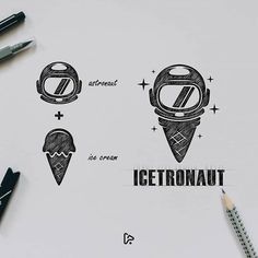 an ice cream logo is shown on a piece of paper next to markers and pencils