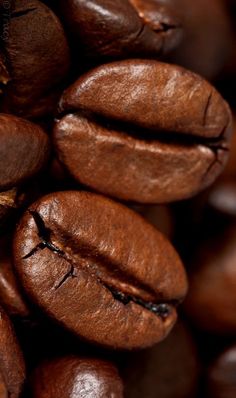 coffee beans are piled on top of each other