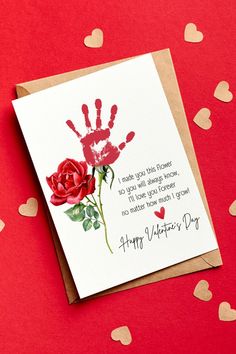 a valentine's day card with a handprinted rose