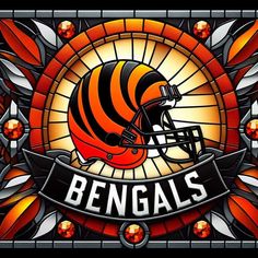 a stained glass window with a football helmet and the word bengals on it, surrounded by leaves