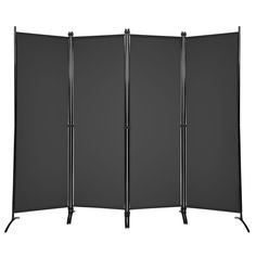 three panel room divider with metal legs and black fabric, in front of a white background