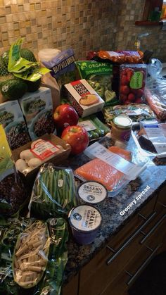 a kitchen counter filled with lots of food