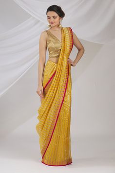 Yellow Chanderi saree with all over silver stripes and pink silk border. 
Components: 1
Fabric: Chanderi


Color: Yellow

Note: Blouse worn by the model is not for sale - Aza Fashions Striped Saree, Saree Yellow, Chanderi Saree, Saree For Women, Yellow Saree, Work Sarees, Pink Silk, Indian Design, Not For Sale