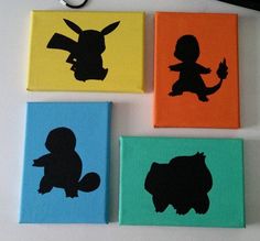 four different colored blocks with black silhouettes of pokemon and eeons on them, each painted in different colors