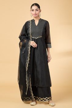 Black yoke embroidered kurta with cutwork and sequins embroidery. Paired with coordinating pant and scallop hem dupatta. - Aza Fashions Black Chikankari Embroidered Palazzo Set For Navratri, Festive Black V-neck Sets, Black Embroidered Cotton Silk Set, Black Chanderi Kurta With Embroidered Border, Black Cotton Silk Sets With Zari Work, Black Silk Sets With Chikankari Embroidery, Festive Black Cotton Silk Set, Black Chanderi Palazzo Set With Mirror Work, Black Sharara With Embroidered Border For Eid