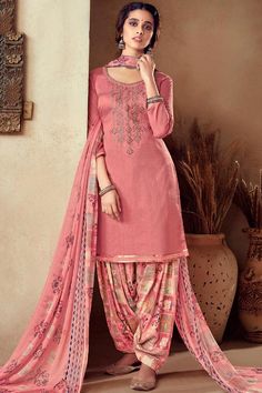 A stylish interpretation of ethnic glamour and contemporary style, this Pink Cotton Patiala Suit which will surely grabs everyone attention. This Round neck and Quarter Sleeves Wedding Wear Dress perfectly formed using resham, zari and stone work. Teamed up with Cotton Patiala Salwar in Pink Color with Pink Chiffon Dupatta. Patiyala Salwar, Unique Dress