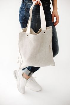 "Natural color pure linen tote bag is perfect for your lunch, goods from shop or market, or even for traveling. The linen fabric is very strong material so it's secure. On the other hand, it's an eco-friendly fabric for food products. ● STRONG and DURABLE MATERIAL. Linen has a value of timelessness, so you can be sure that this organic tote bag is for long use. ● STRONG HANDLES. Handles are with rivets that guarantee safe, secure and long-lasting use. ● INNER POCKET with ZIPPER. Your small thing Summer Canvas Bag With Pockets For Shopping, Summer Shopping Canvas Bag With Pockets, Summer Canvas Shopping Bag With Pockets, Summer Reusable Canvas Bag, Beige Reusable Tote Canvas Bag, Eco-friendly Summer Bags With Pockets, Everyday Linen Tote Canvas Bag, Everyday Linen Canvas Tote Bag, Everyday Natural Reusable Bag