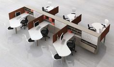 an office cubicle with multiple desks and chairs