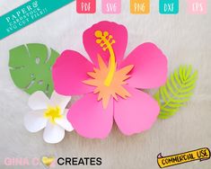 paper flowers and leaves on a white furnishing with text overlay that reads create your own tropical flower