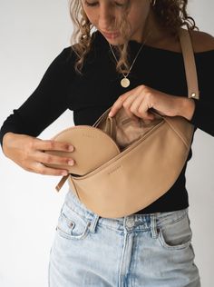 Meet the Atlas in Sand – now with more secret pockets and features to make staying organized on the go that much easier. Chase your next adventure and let this timeless leather fanny pack design carry you from plane ride to sunset and everywhere in between. Handmade by artisans in Bali, this roomy design is both elegant and versatile. For endless styling freedom, easily adjust the leather strap to wear as a bum bag, cross-body or over-the-shoulder. Modern Soft Leather Belt Bag For Daily Use, Modern Soft Leather Belt Bag For Everyday, Functional Beige Belt Bag For Travel, Modern Belt Bag With Pockets For Daily Use, Leather Travel Belt Bag With Pockets, Leather Belt Bag With Cell Phone Pocket For Travel, Leather Belt Bag For Travel, Leather Belt Bag With Pockets For Travel, Modern Leather Belt Bag With Pockets