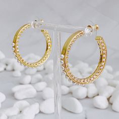 These Classy Lady Pearl Hoop Earrings are perfect for everyday wear and any special occasions. With a beautiful mix of elegance, glamour and edginess, these earrings are sure to make a statement. Crafted with beautiful design, setting and details, you'll be glad to have these in your collection. Dimensions: approximately 1.2" diameter 18K Gold Plated plated Brass, cubic zirconia, pearl beads Lead and Nickel Free Made in China Classy Lady, Womens Watches Luxury, Pearl Collection, Pearl Hoop Earrings, Beaded Hoop Earrings, Beaded Hoops, Classy Women, Scrunchie Hairstyles, Steel Jewelry