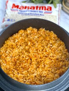 a pan filled with rice sitting on top of a stove