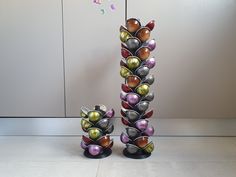 there are two vases that have been made out of metal balls on each side