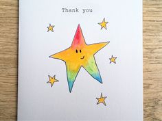 a thank card with a watercolor drawing of a star and the words, thank you