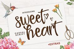 sweet heart script with flowers and scissors