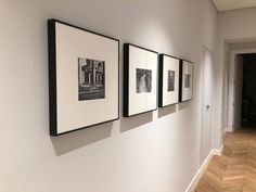 three black and white photographs hanging on the wall