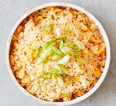 a white bowl filled with rice and vegetables