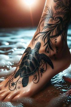 a tattoo on the foot of a woman with a sea turtle and starfish design